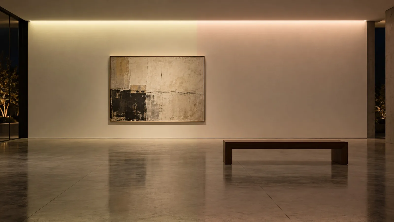 A gallery wall lit by one continuous cove, where the left half looks slightly green and the right half slightly pink